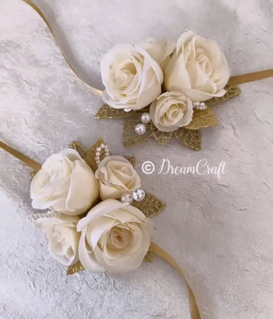 Ivory rose boutonnieres with gold accents